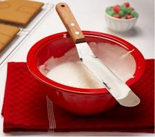 Red bowl of icing with spatula.jpg